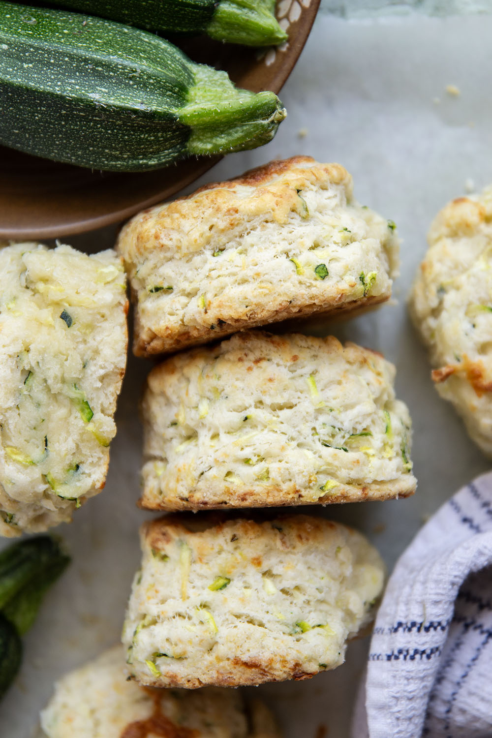You'd never guess that these light and flaky biscuits are loaded up with shredded zucchini! Paired with nutty Parmesan, these zucchini biscuits are definitely a keeper summer recipe.