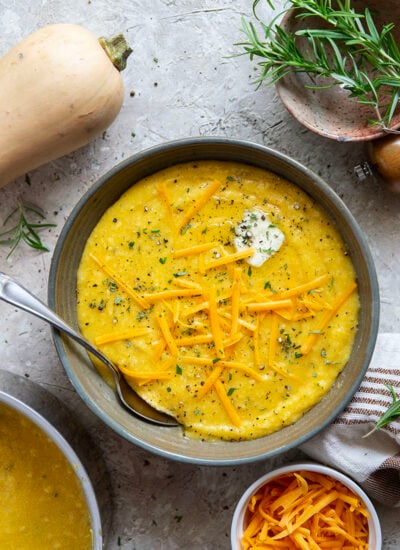 Sharp melted cheddar cheese and creamy homemade butternut squash puree make an incredible fall pairing in this rich and creamy butternut squash polenta.