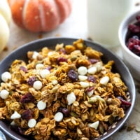 This crisp pumpkin granola has a delightful fall twist of warming spices, real pumpkin puree, white chocolate, and dried cranberries.