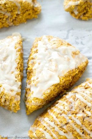 Learn how to make coffee shop-style pumpkin spice scones at home with this easy recipe! They're perfect alongside a cup of coffee.