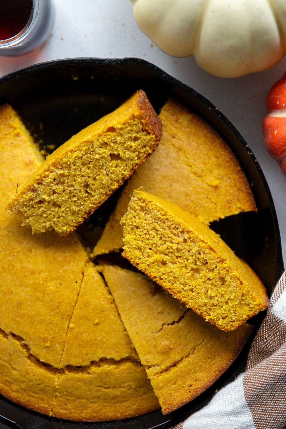 Plenty of fall spices and pumpkin collide in this soft and perfectly spiced pumpkin cornbread that pairs like a dream with a bowl of chili!