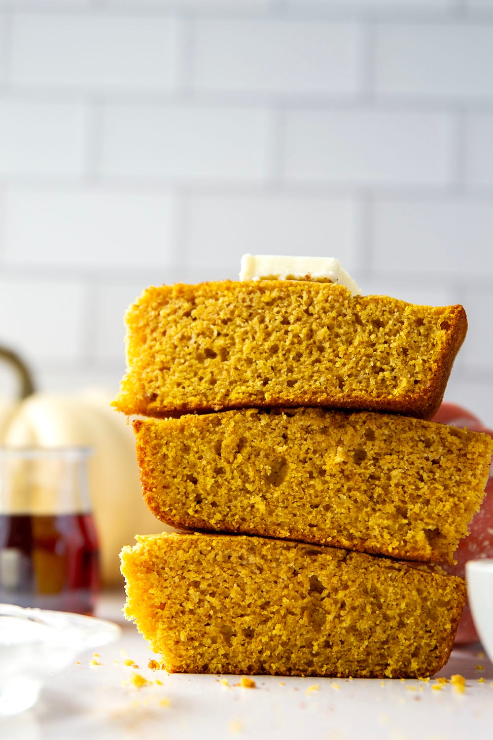 Plenty of fall spices and pumpkin collide in this soft and perfectly spiced pumpkin cornbread that pairs like a dream with a bowl of chili!