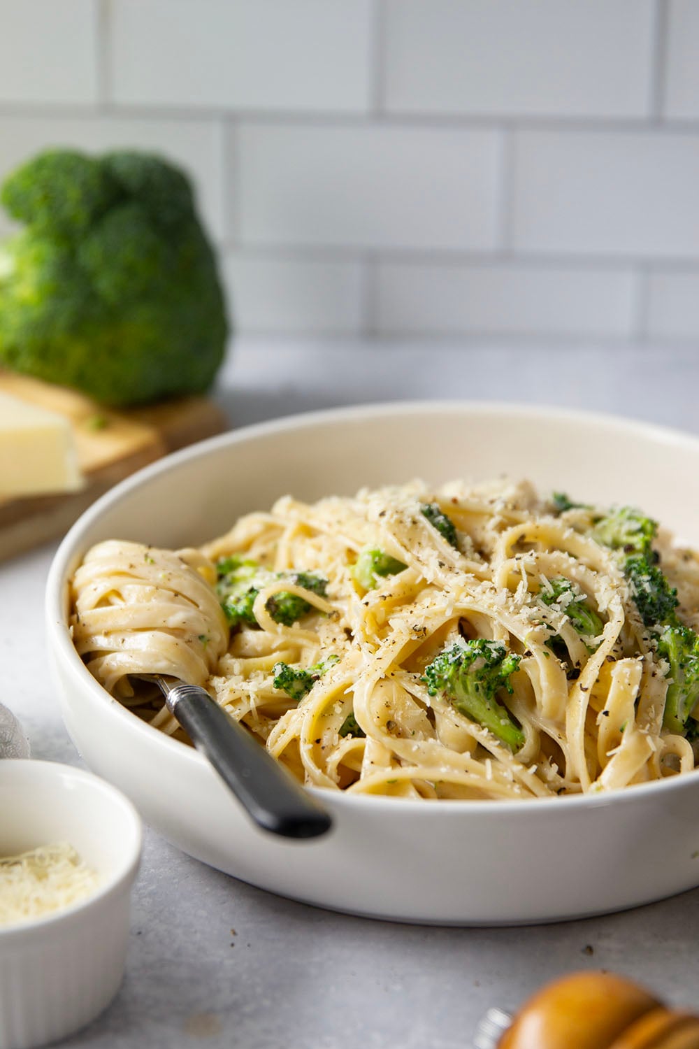This broccoli fettuccine alfredo is ready in a snap and features tender broccoli florets and pasta in a rich Parmesan alfredo sauce.