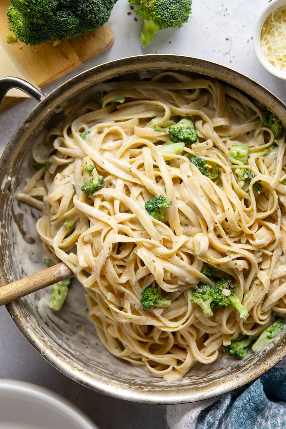 This broccoli fettuccine alfredo is ready in a snap and features tender broccoli florets and pasta in a rich Parmesan alfredo sauce.