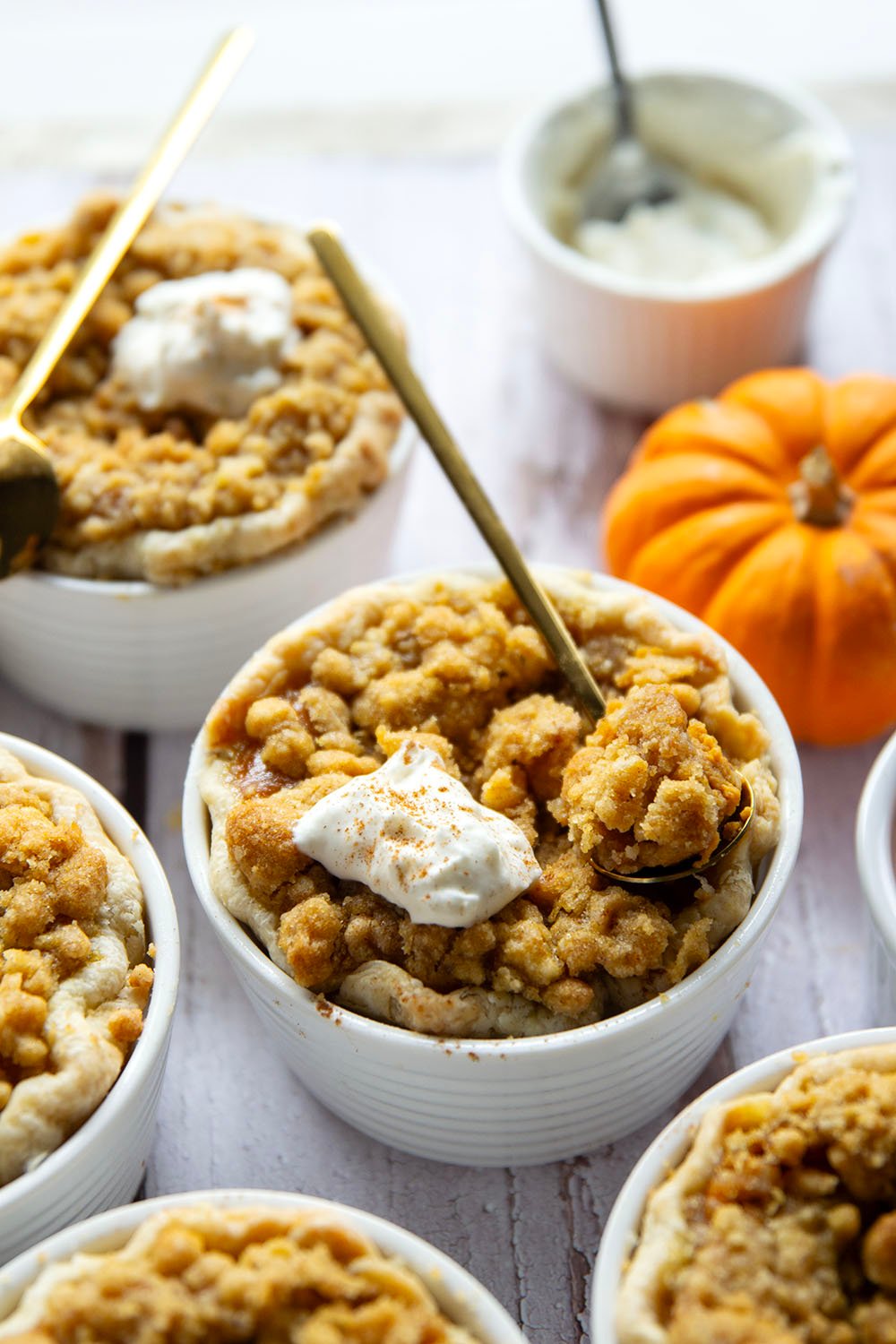 Loaded with buttery streusel on top of silky pumpkin filling, these mini pumpkin pies are the perfect way to get your pumpkin pie fix in personal-sized form!