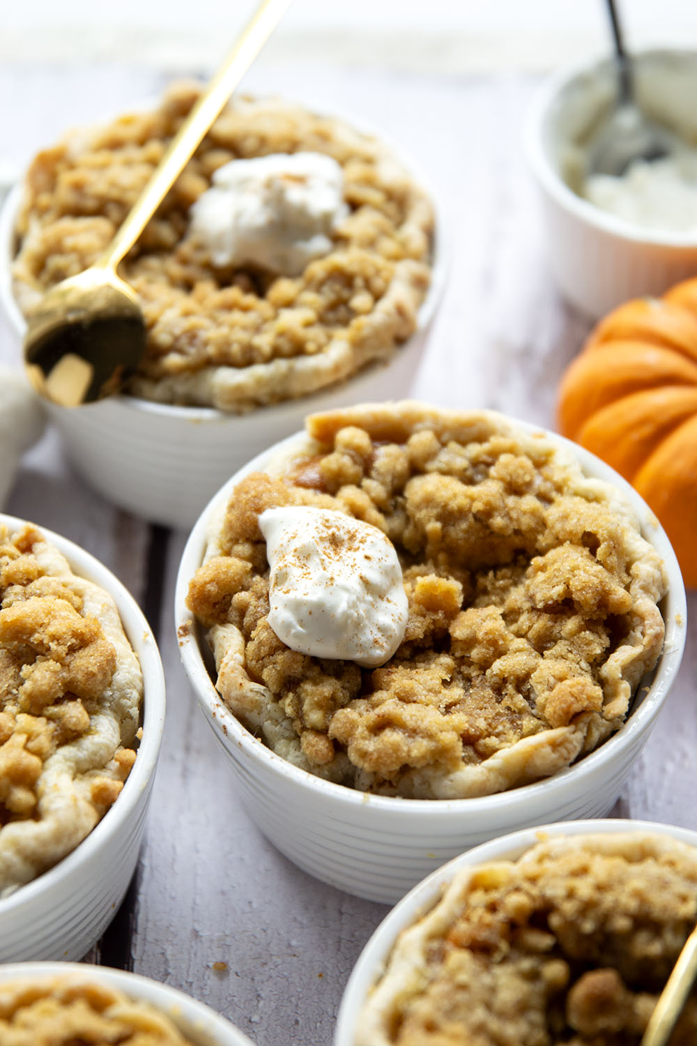 Loaded with buttery streusel on top of silky pumpkin filling, these mini pumpkin pies are the perfect way to get your pumpkin pie fix in personal-sized form!