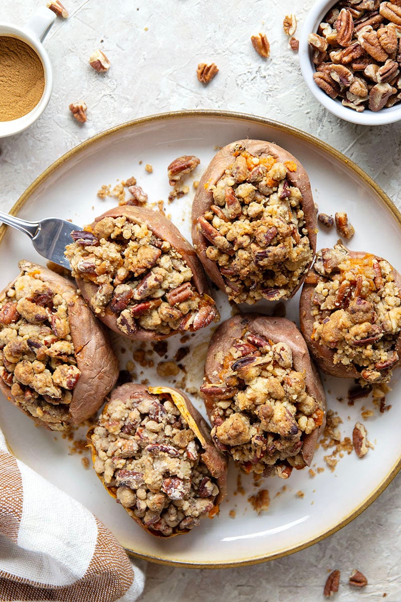 Piled high with buttery pecan streusel and baked twice to perfection, these twice-baked sweet potatoes will be the biggest hit of your Thanksgiving dinner!
