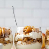 Add a little fun to your fall breakfast, with these apple crisp parfaits! They whip up in less than 10 minutes and are layered with crunchy granola, caramelized apples, and creamy vanilla yogurt.