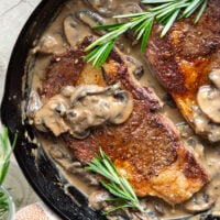 Learn how to cook a perfect restaurant-style ribeye steak with mushroom sauce with this keeper recipe. The steak sears up buttery tender every time and is fantastic with a creamy stout mushroom sauce draped over top.