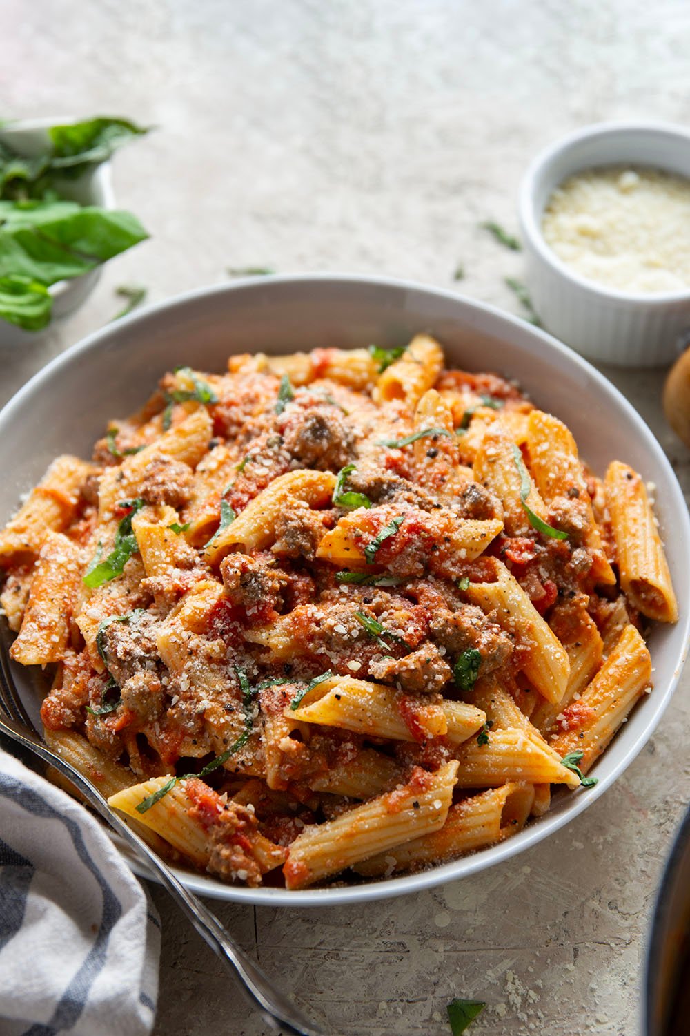 Penne alla vodka with sausage features a flavorful homemade vodka tomato sauce with juicy browned sausage. - an easy weeknight dinner that's ready in under an hour!