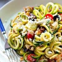 You won't be able to stop eating this flavorful zucchini noodles salad! Loaded with tons of fresh, healthy Mediterranean goodness and an unbelievable sun-dried tomato dressing.