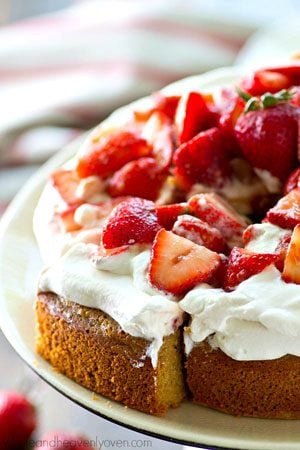 Classic summertime strawberry shortcake is made EASY in this single-layer yellow cake that's piled high with fluffy whipped cream and lots of fresh strawberry sauce!