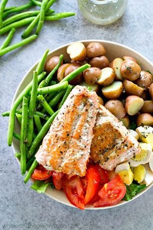 Golden seared salmon, tender fingerling potatoes and fresh green beans, and plenty of other nicoise salad goodness comes together in this beautiful main-dish salad!