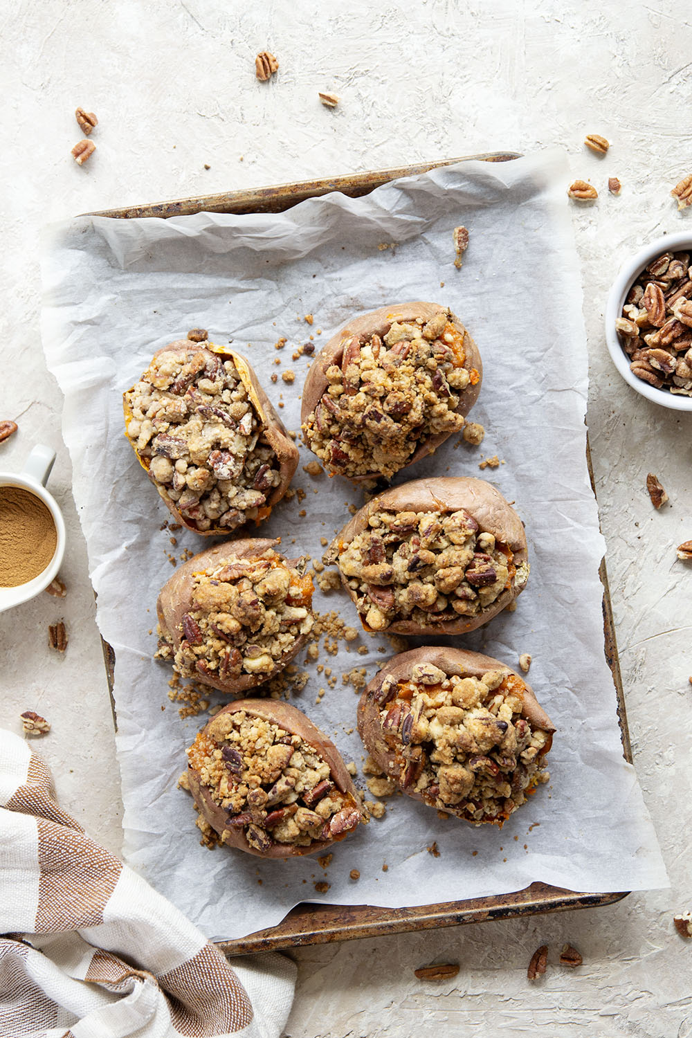 Piled high with buttery pecan streusel and baked twice to perfection, these twice-baked sweet potatoes will be the biggest hit of your Thanksgiving dinner!