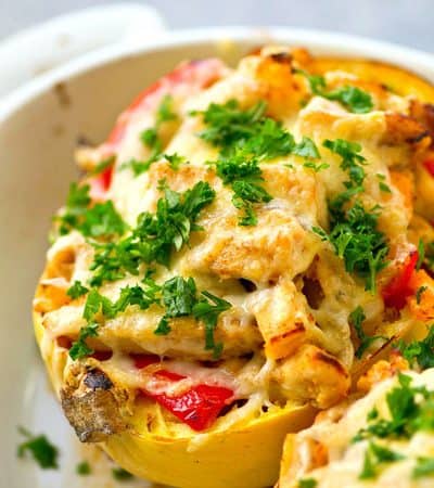 All the things you love about chicken fajitas stuffed into huge cheese-covered spaghetti squash boats! An entire dinner-in-one that's incredibly easy to throw together too.