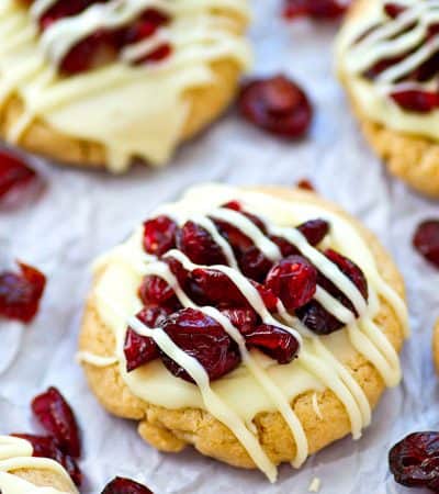 Love the cranberry bliss bars from Starbucks? You've GOT to try them in festive sugar cookie form! You won't believe how easy these little cookie gems are to make.