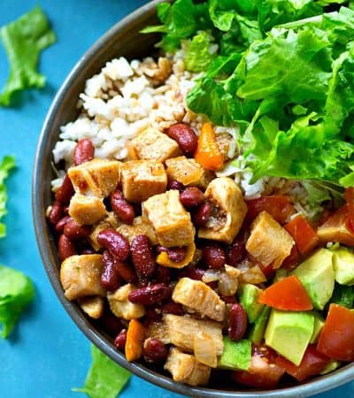 Loaded with spicy chicken and beans, tons of hot rice, and all the salad bowl 'fixins, these flavorful weeknight salad bowls are the EASIEST way to get everyone to eat their salad!