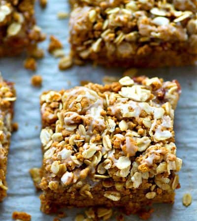 These loaded cookie bars are a peanut butter and jelly lover's dream! An oatmeal streusel topping and tons of glaze drizzled on top make them so fun and kid-friendly.