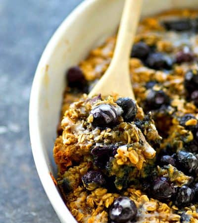 This easy and energy-packed baked oatmeal is loaded full of blueberry muffin goodness and covered in a sweet vanilla glaze. Enjoy it with milk or straight outta the pan!