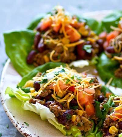 All the things you love about taco salad are piled into these INSANELY flavor-packed taco salad lettuce wraps! They're ready to go in 20 minutes with only a handful of simple ingredients.