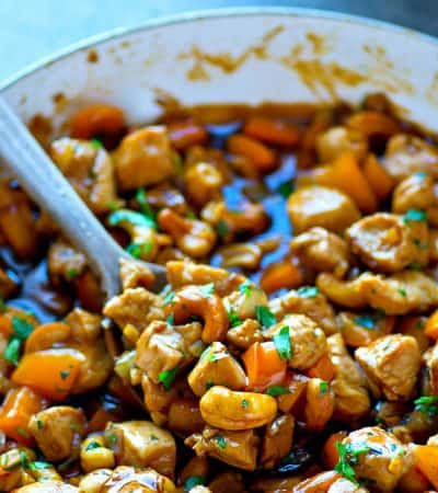This flavorful twist on classic cashew chicken stir-fry features tons of sweet peppers and fresh ginger in a rich sauce. Pile it all over a mound of rice for a dinner WAY better than take-out!