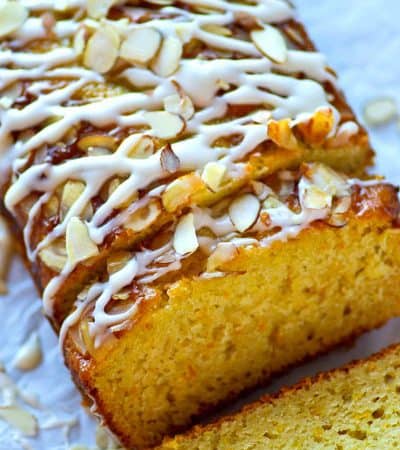 Orange and almonds are a match made in heaven in this INSANELY-moist glazed almond orange quick bread! It's quick to throw together and disappears even faster.