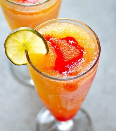 These tequila sunrise slushies are a frozen twist off of the classic cocktail and they're SO easy to blend up! Make a double batch because these sippers are gonna disappear fast.