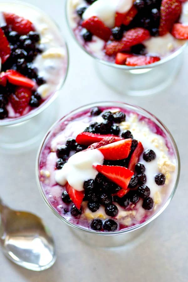 Super-creamy and layered with vanilla greek yogurt and tons of mixed berries, these mixed berry overnight oats are a CINCH to throw together the night before and a perfect morning boost.