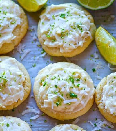 Soft lime-flavored sugar cookies are a match made in heaven with a dreamy coconut frosting heaped on top! These lime sugar cookies will be a hit anywhere you take them.