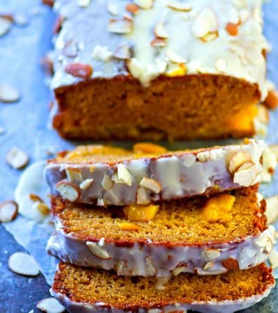 Fresh peaches and amaretto are a match made in heaven in this SUPER-soft glazed amaretto peach quick bread! Perfect way to use up those summer peaches.