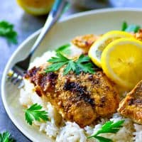 Traditional tandoori grilled salmon is marinated in a spiced yogurt marinade, grilled until tender, and piled on top of fluffy lemon basmati rice.--it'll quickly become a dinner regular!