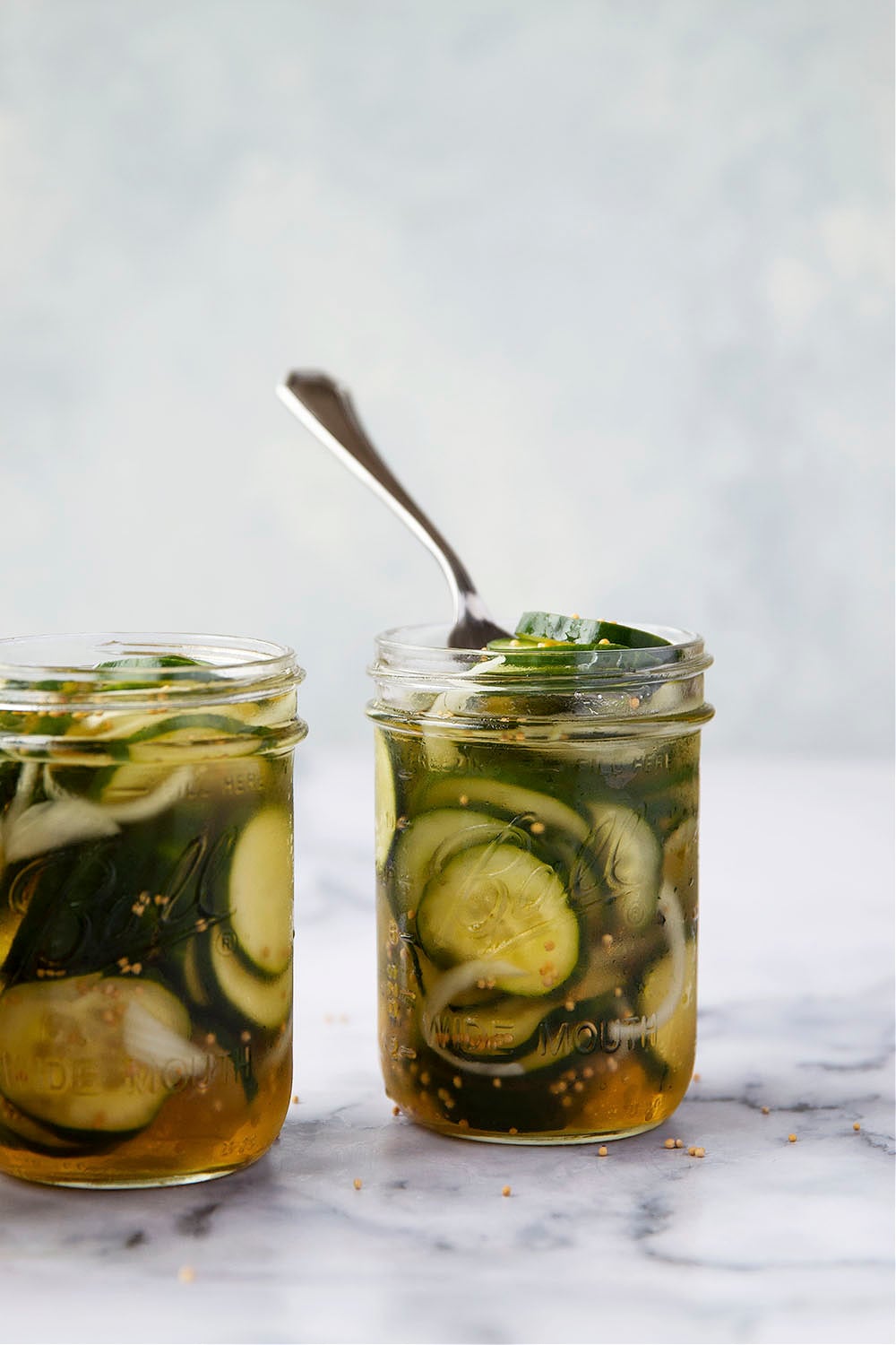 These refrigerator bread and butter pickles are made entirely in the fridge overnight and perfectly crisp, sweet, and tangy. - perfect for using up a bounty of cucumbers!