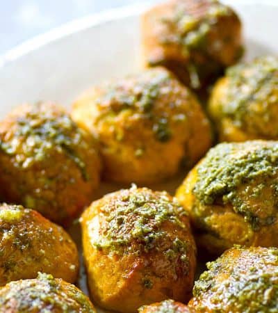 Soft pretzel bites could not be EASIER to make at home! These Parmesan pesto soft pretzel bites are unbelievably soft, chewy, and covered in flavorful pesto and Parmesan cheese.