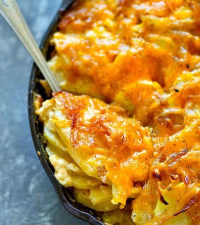 Creamy, comforting smoked cheddar caramelized onion scalloped potatoes are the ultimate holiday side dish to add to your menu! Easy to make and such a huge crowd-pleaser.