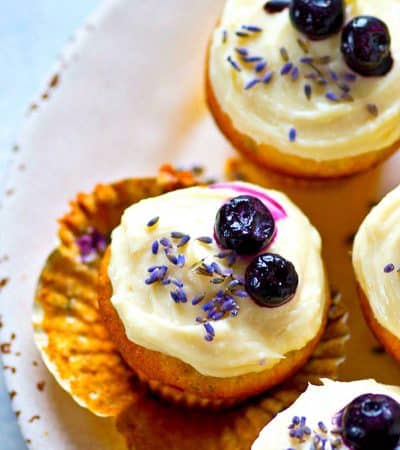 Fragrant lavender and juicy blueberries join forces in these SUPER soft blueberry lavender cream cheese cupcakes crowned with a silky cream cheese frosting.