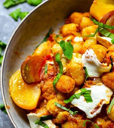 Juicy roasted heirloom tomatoes and creamy fresh mozzarella make the most amazing flavor duo in this summery mozzarella gnocchi skillet that you'll have on the table in MINUTES!