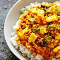 Charred sweet corn and tender zucchini cubes in an INSANELY flavorful coconut curry sauce piled over fluffy rice make this zucchini coconut curry one for the summer books!