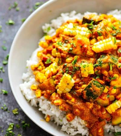 Charred sweet corn and tender zucchini cubes in an INSANELY flavorful coconut curry sauce piled over fluffy rice make this zucchini coconut curry one for the summer books!