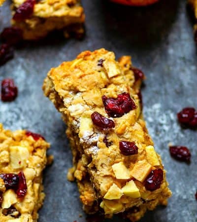 Cranberry Apple Oatmeal Breakfast Bars - Grab 'n' go breakfast don't get much better than these cranberry apple oatmeal breakfast bars! They're SUPER filling, incredibly soft, and packed with chewy cranberries and soft apple pieces!