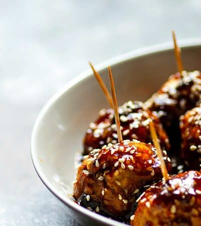 Instant Pot Honey Sesame Glazed Chicken Meatballs - The instant pot makes these honey sesame glazed chicken meatballs SUPER tender and they're smothered to perfection in a sweet 'n' savory honey sesame sauce! The BEST app you'll ever make.