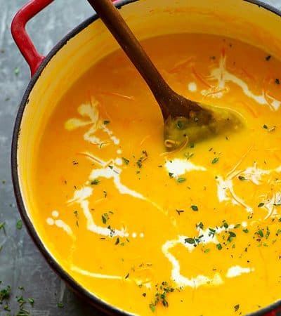 Pumpkin Beer Cheese Soup - Creamy pumpkin beer cheese soup is going to be your FAVORITE way to warm up! Flavorful beer, silky fresh pumpkin puree, and tons of cheddar build SO much flavor in this cozy soup.