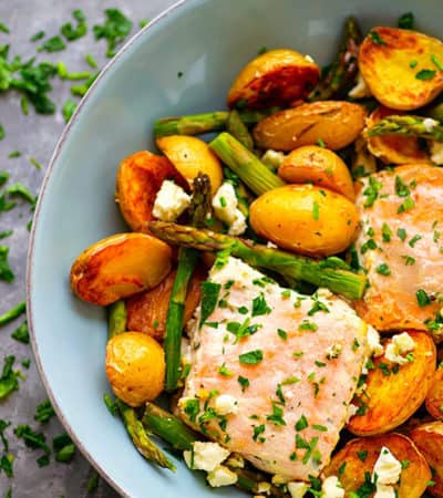 Sheet Pan Greek Salmon - Made entirely on one sheet pan and packed FULL of incredible Greek flavors, this Greek salmon and fingerling potatoes will quickly become a regular part of the dinner rotation!