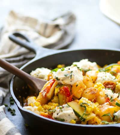 Crispy pan fried gnocchi is loaded with sweet charred corn, juicy cherry tomatoes, and creamy herbed ricotta for an easy 30-minute dinner just brimming with summer goodness!