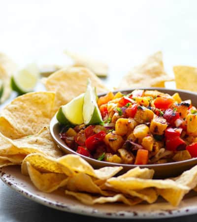 Sweet grilled pineapple and smoky chipotle pepper take this addicting grilled pineapple salsa to an incredible level of flavors! Serve with your favorite chips, on tacos, or over grilled meat.