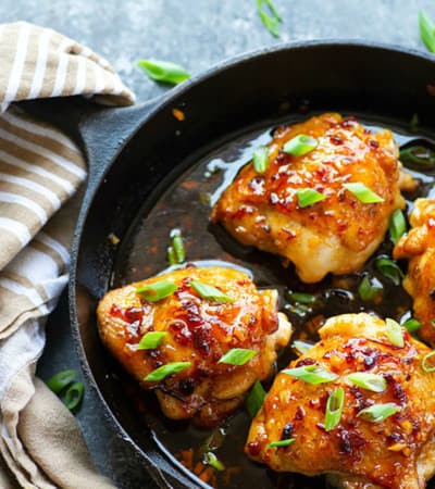 Glazed with a spicy honey chipotle sauce and incredibly juicy, these sticky honey chipotle chicken thighs bake up in only 30 minutes and are the perfect way to kick up your dinner game!