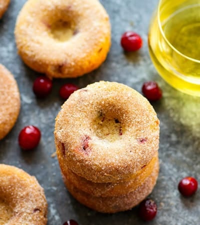 Baked instead of fried and packed full of juicy cranberries, these cranberry baked apple cider donuts are a breeze to bake up at home this fall!