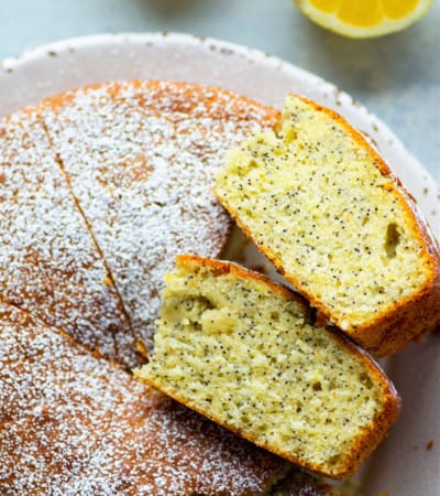 This lemon olive oil cake packs a punch of fresh lemon flavor and poppyseeds in an incredibly soft olive oil cake. Top this simple cake off with a dusting of powdered sugar and watch it disappear!