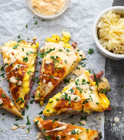 Loaded with all the classic Reuben sandwich fixins' and soft scrambled eggs, these breakfast corned beef quesadillas are fast to whip up and the perfect use for leftover corned beef!