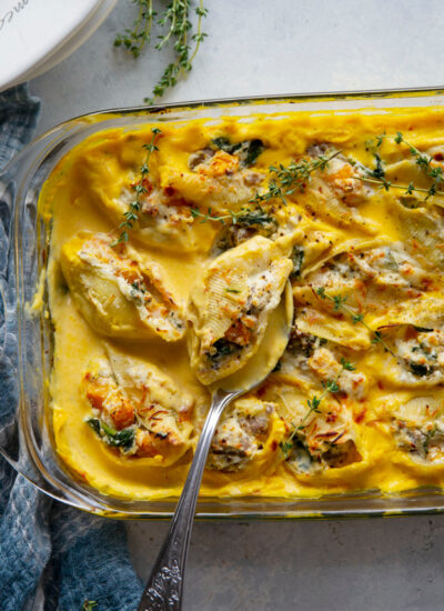 Creamy butternut squash alfredo sauce and flavorful sausage are featured in these luscious butternut squash stuffed shells. - easy to make ahead of time and perfect for any dinner occasion!