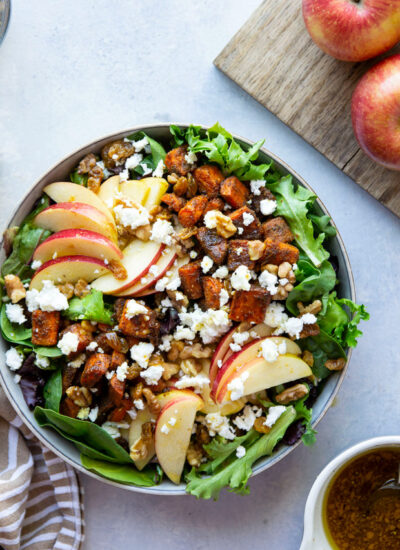 Flavorful Moroccan spice-roasted carrots and crisp apples are the perfect duo in this colorful autumn carrot apple salad that's drizzled in a sweet maple dressing.